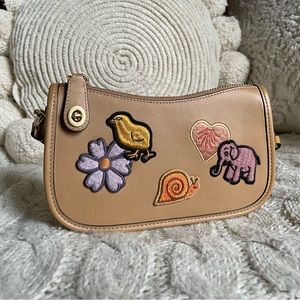 EUC Coach Swinger 20 with creature patches